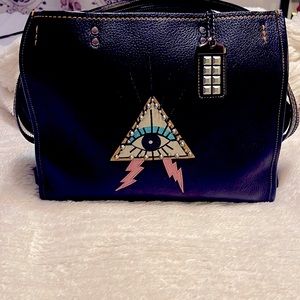 Rogue with pyramid eye Coach purse. Not available online/in stores anymore!